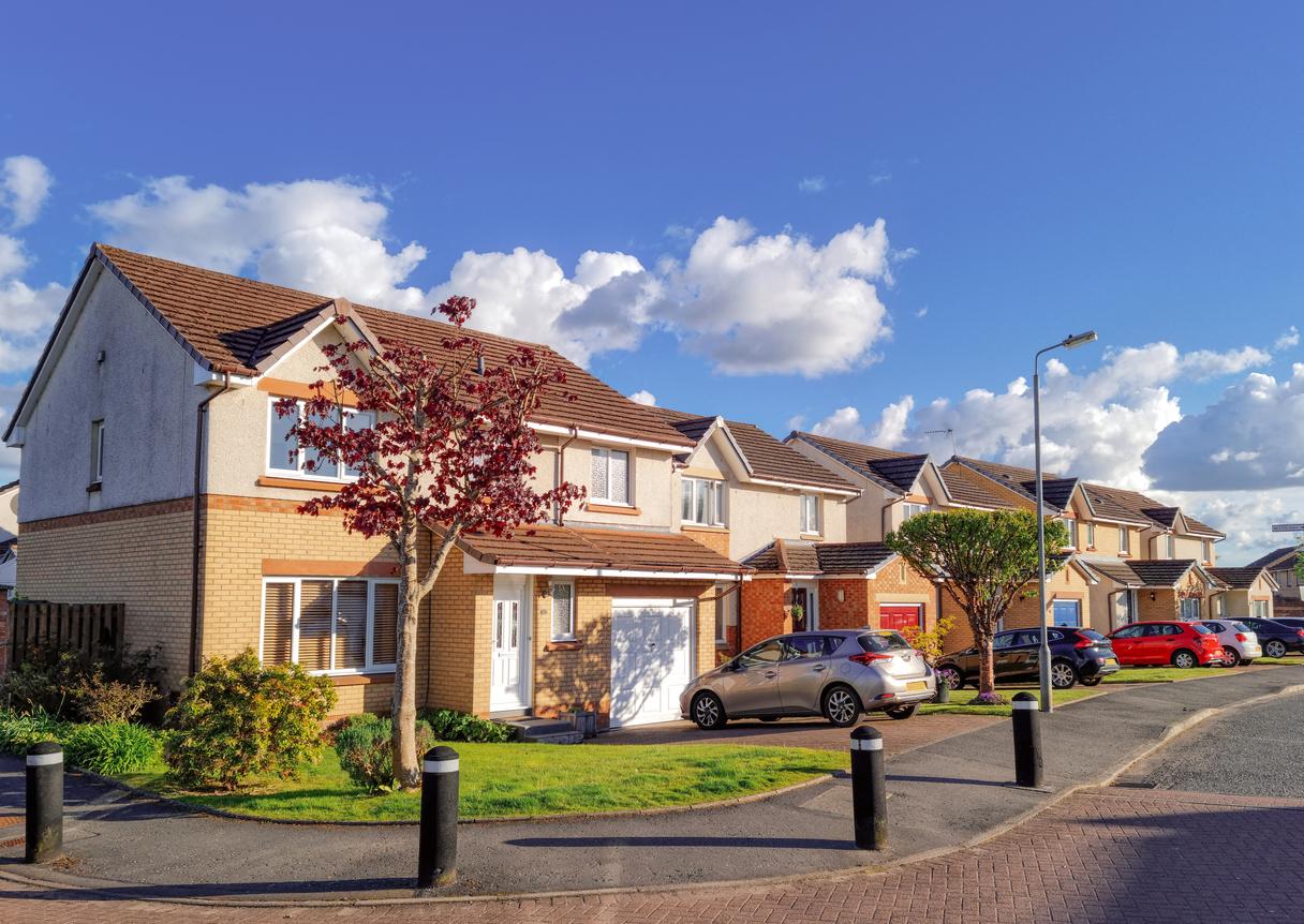 A UK street with houses and trees