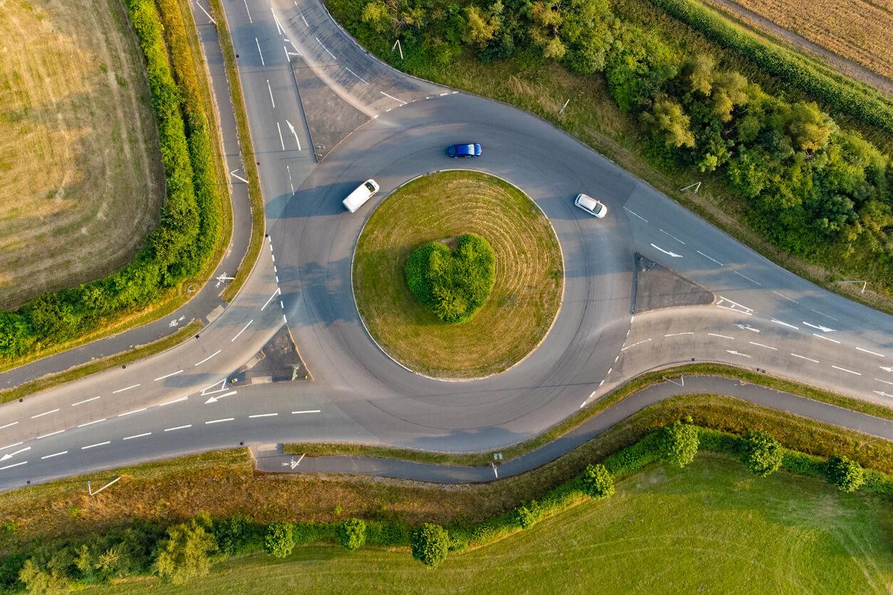 A roundabout with cars driving on it in the UK