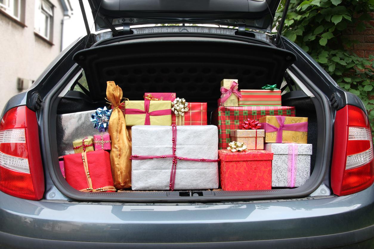 A pile of Christmas gifts in a car boot