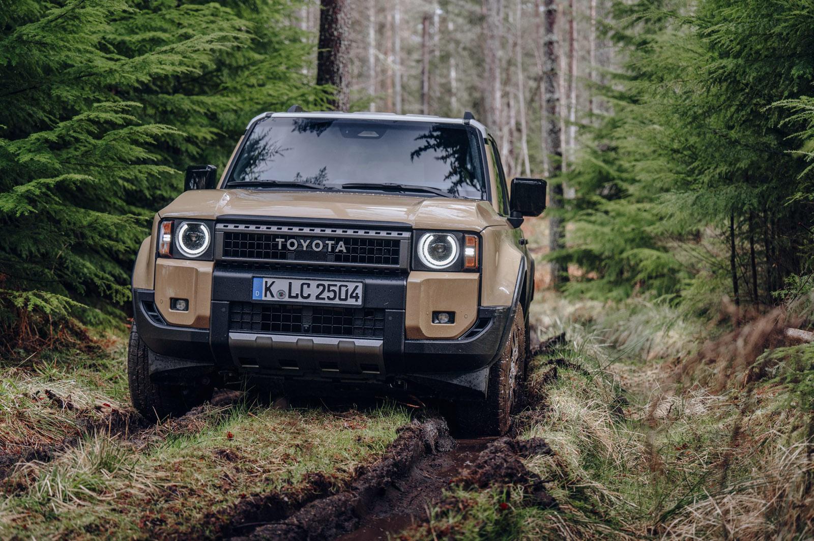a beige toyota land cruiser off-roading