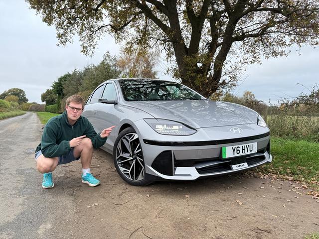 Ben Welham next to a silver Hyundai IONIQ 6