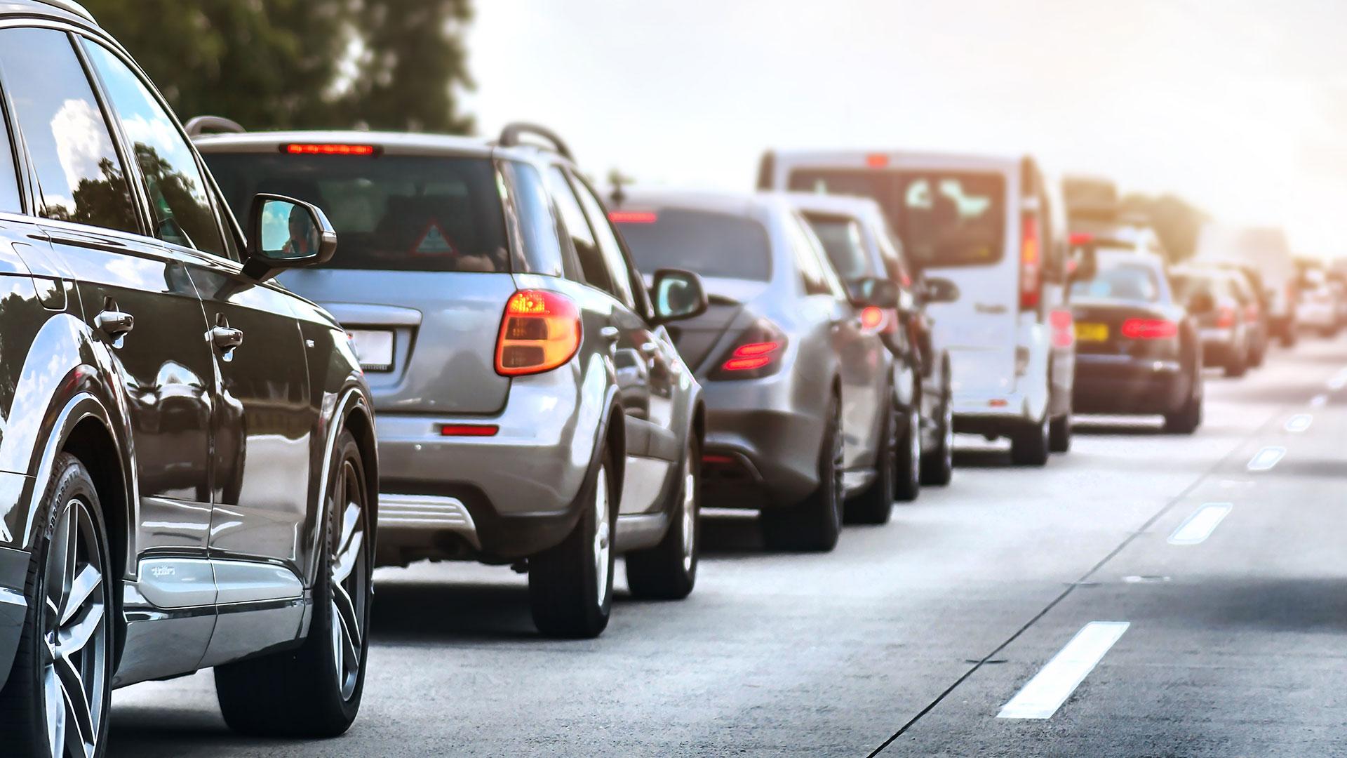 a row of cars in traffic in the UK