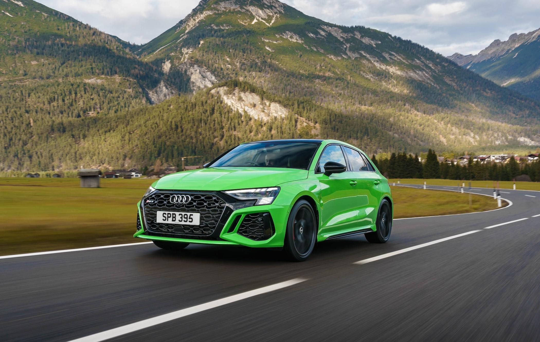 Green Audi RS 3 Sportback driving on road
