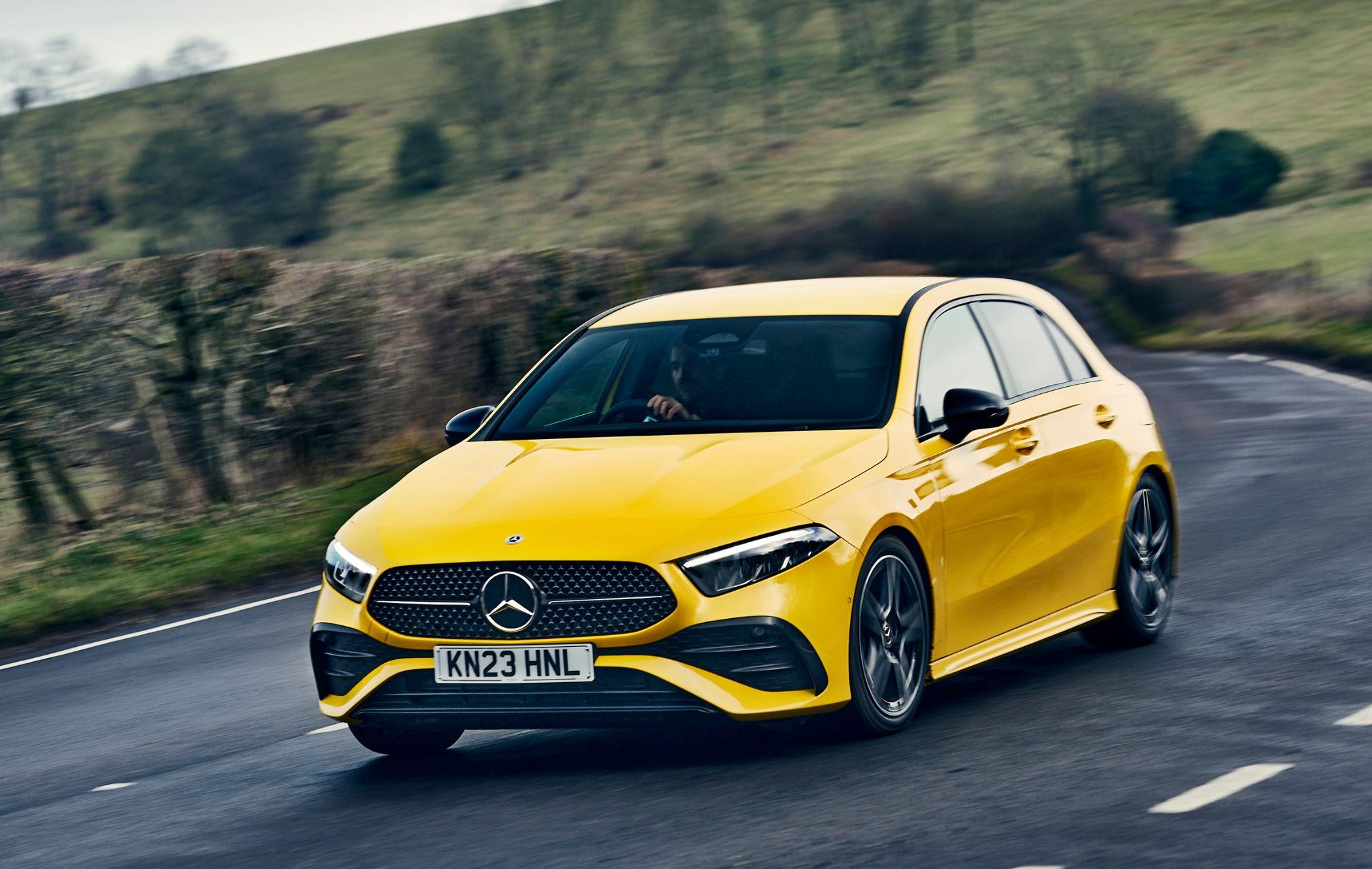 Yellow Mercedes A-Class driving