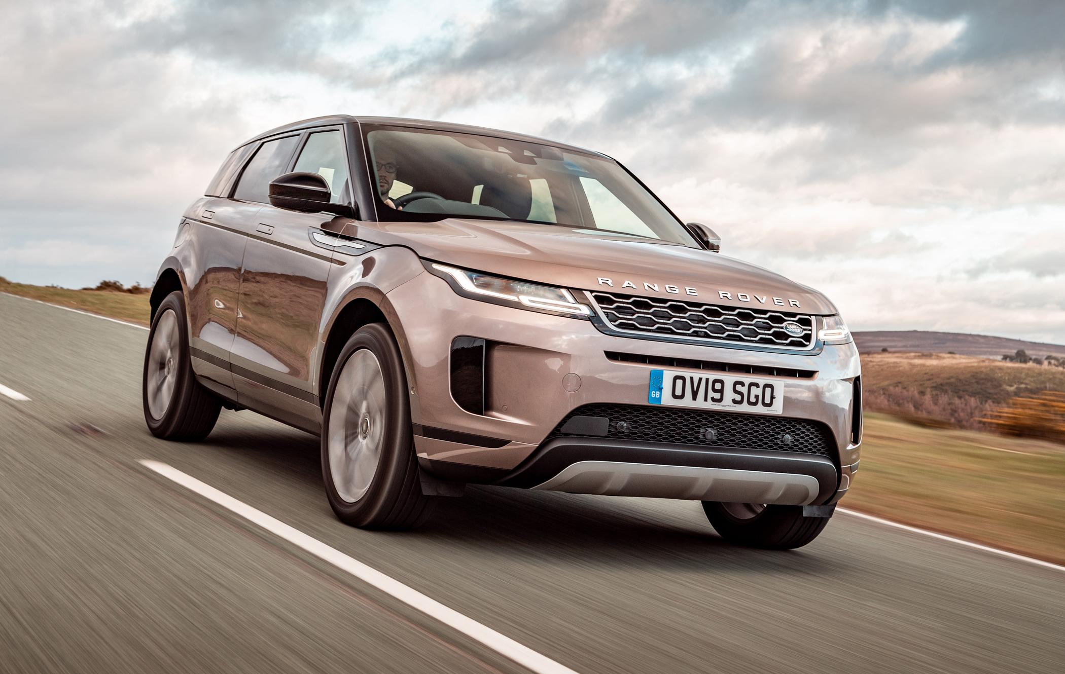 A bronze coloured Range Rover Evoque driving on a country lane