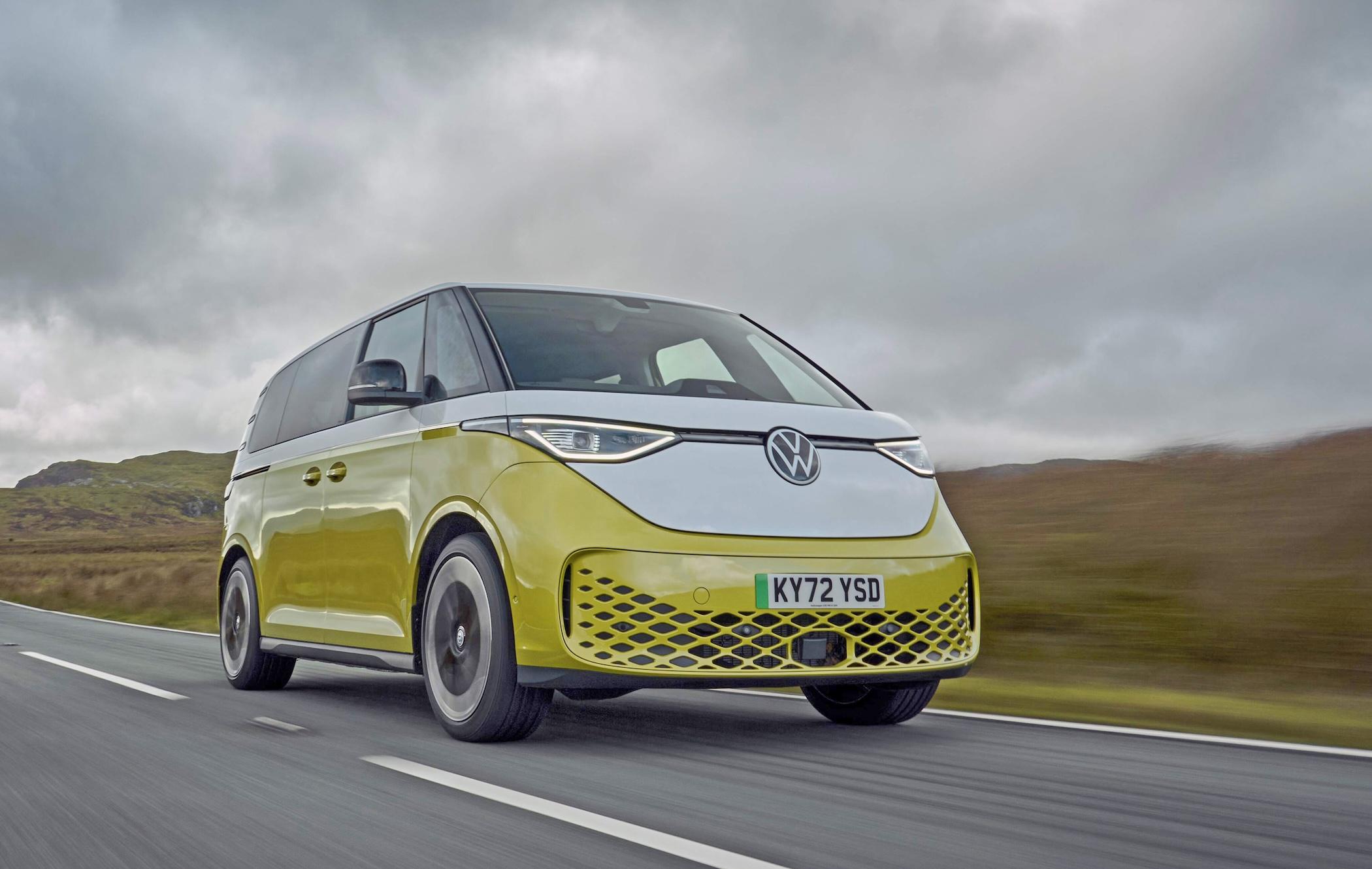 Yellow and white Volkswagen ID.Buzz driving on country road