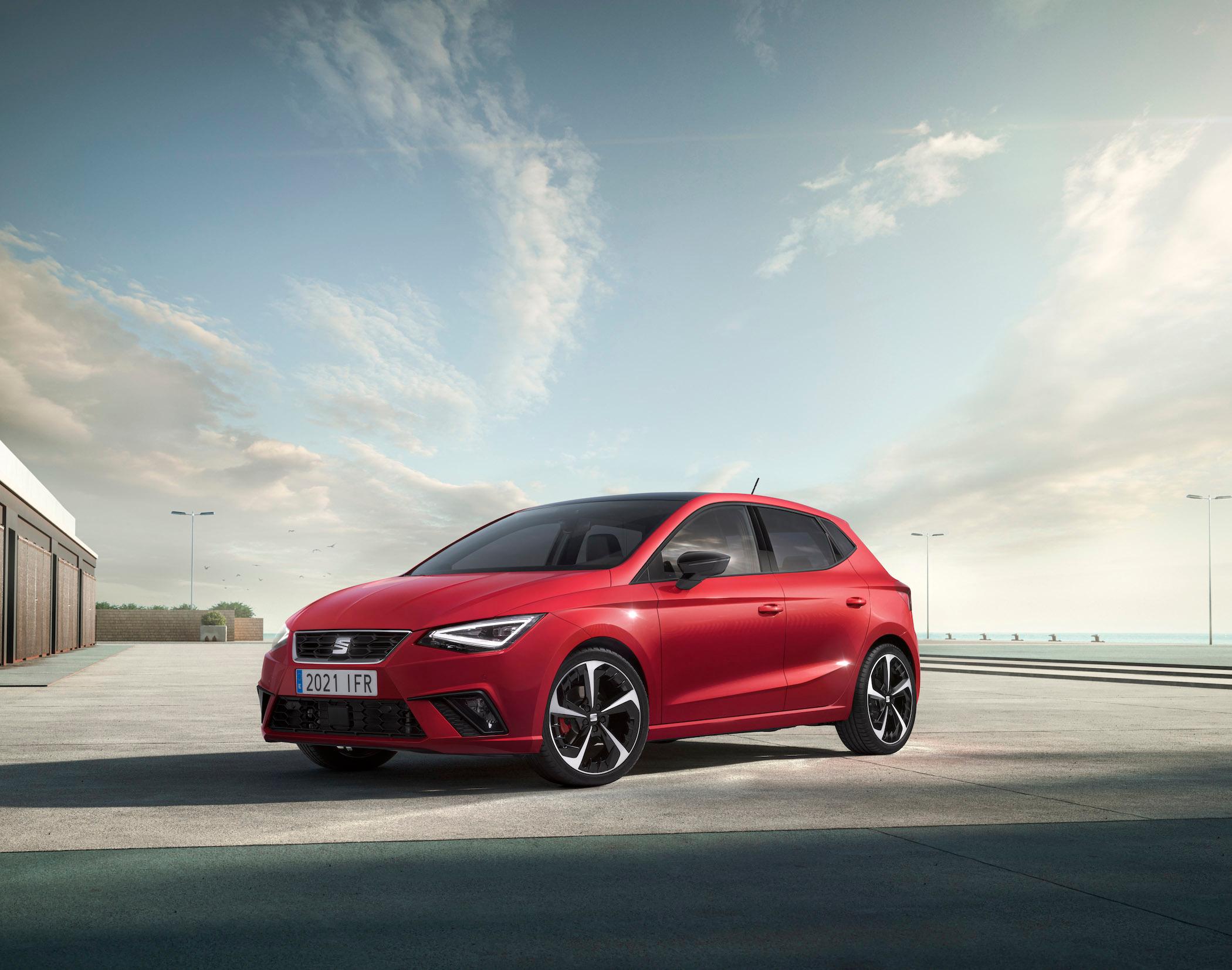 a red seat ibiza parked on concrete