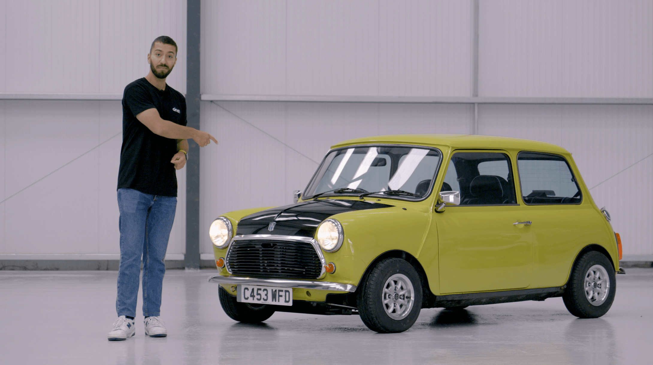 a small yellow classic mini cooper