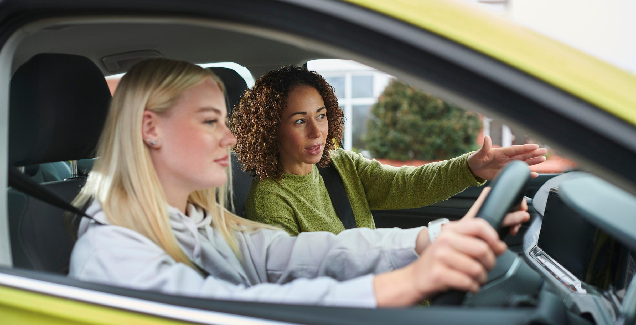 A young girl on a car driving test