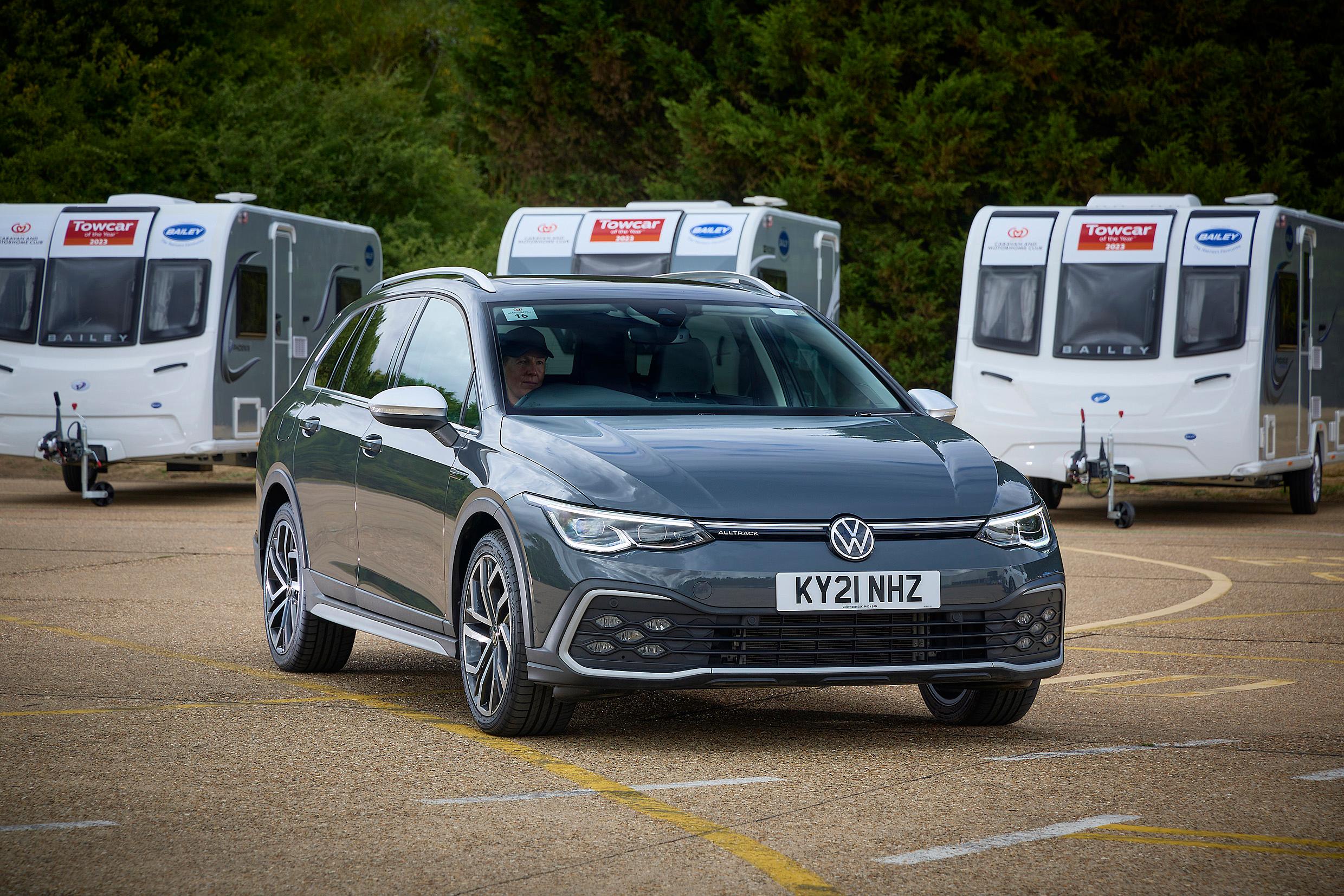 A grey VW Golf Estate DSG parked with caravans