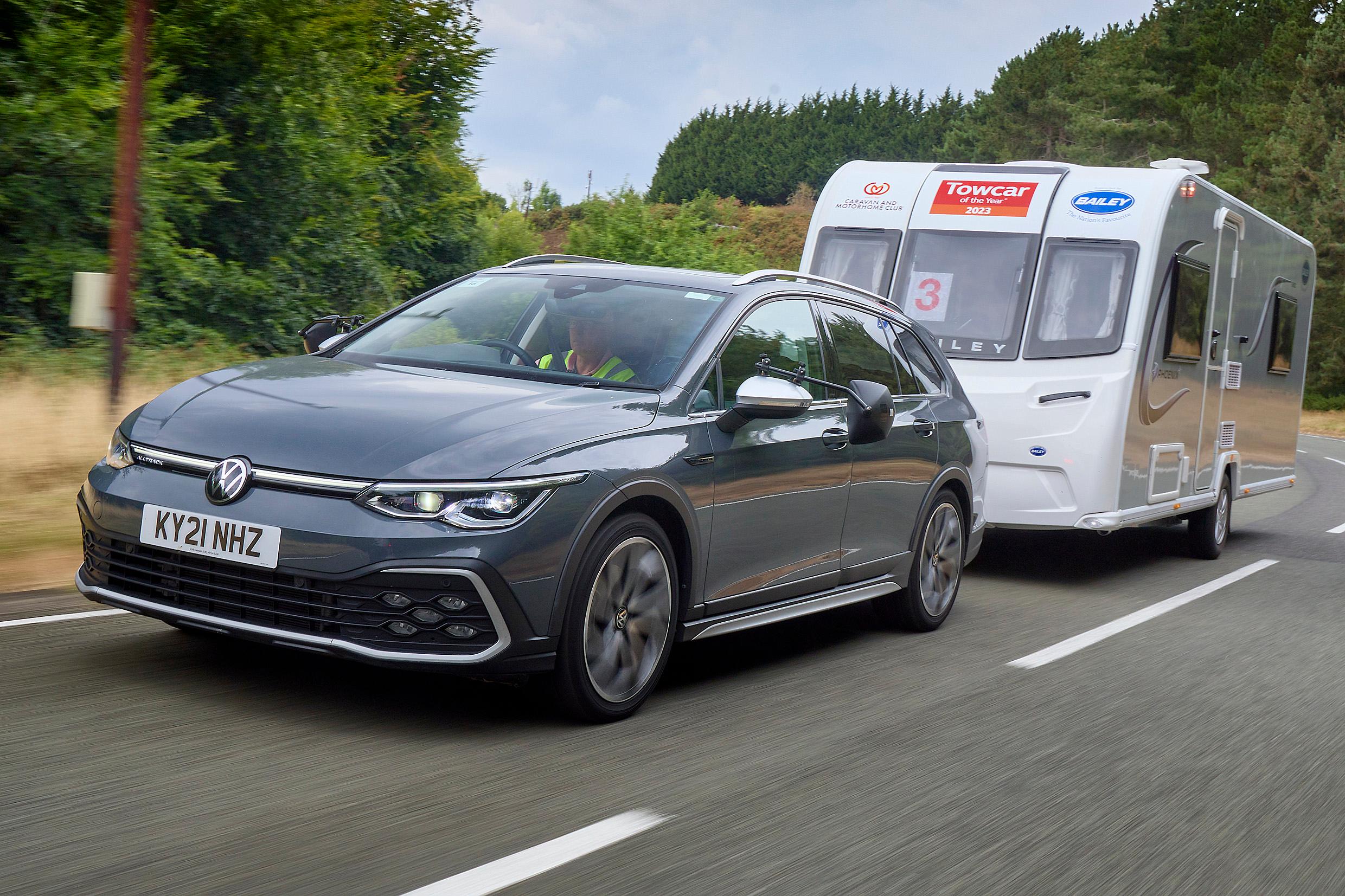 A Volkswagen Golf Estate Alltrack pulling a caravan