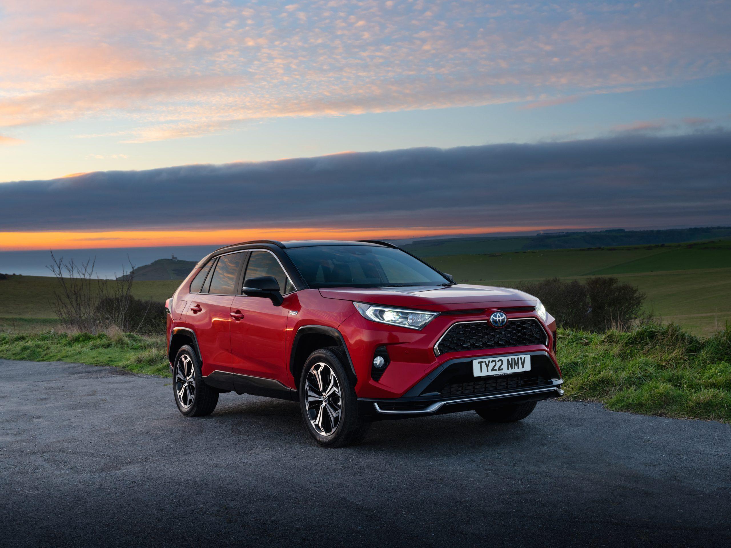 A red Toyota RAV4 hybrid