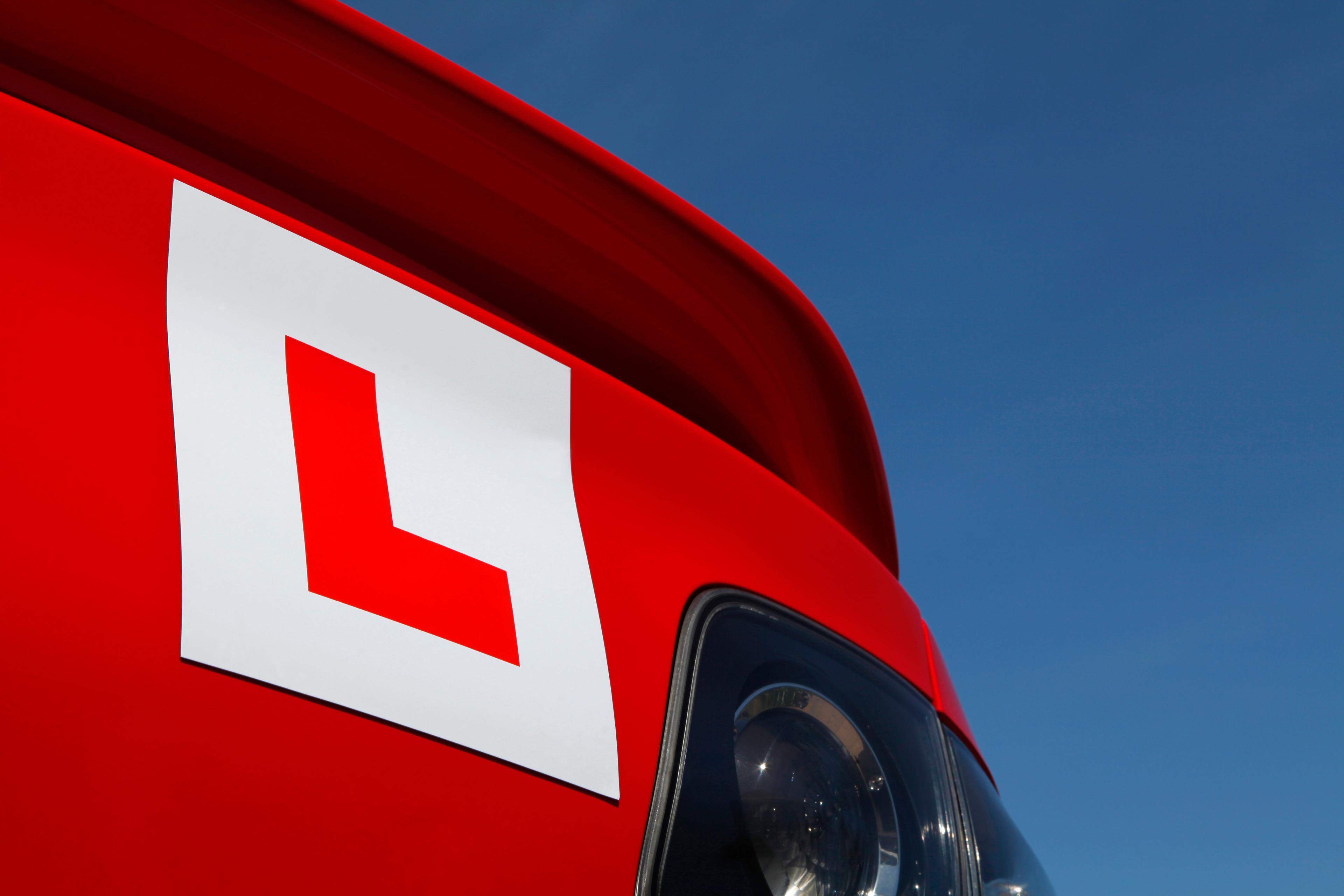 Red Mazda with L plate