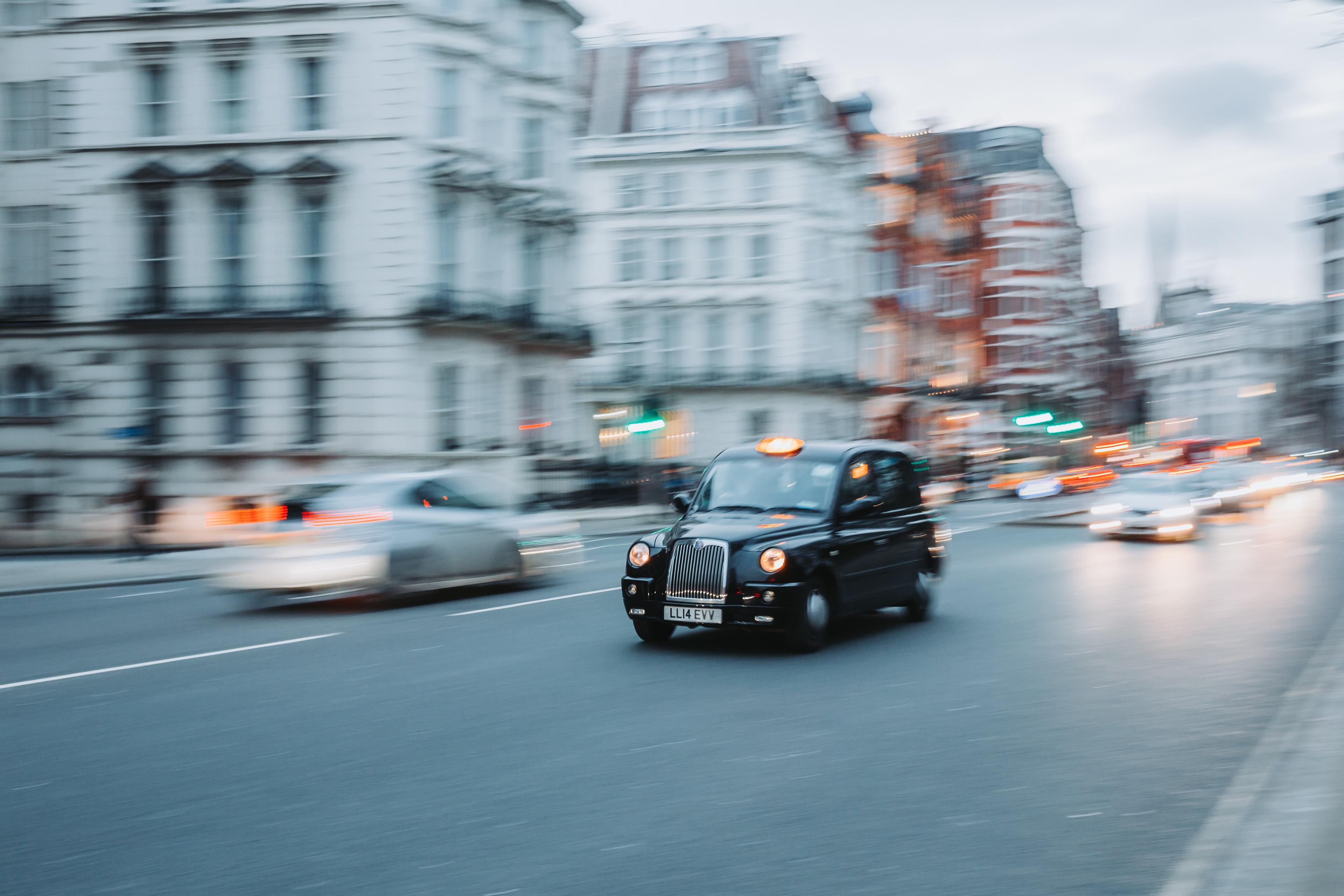 someone driving a taxi along a road