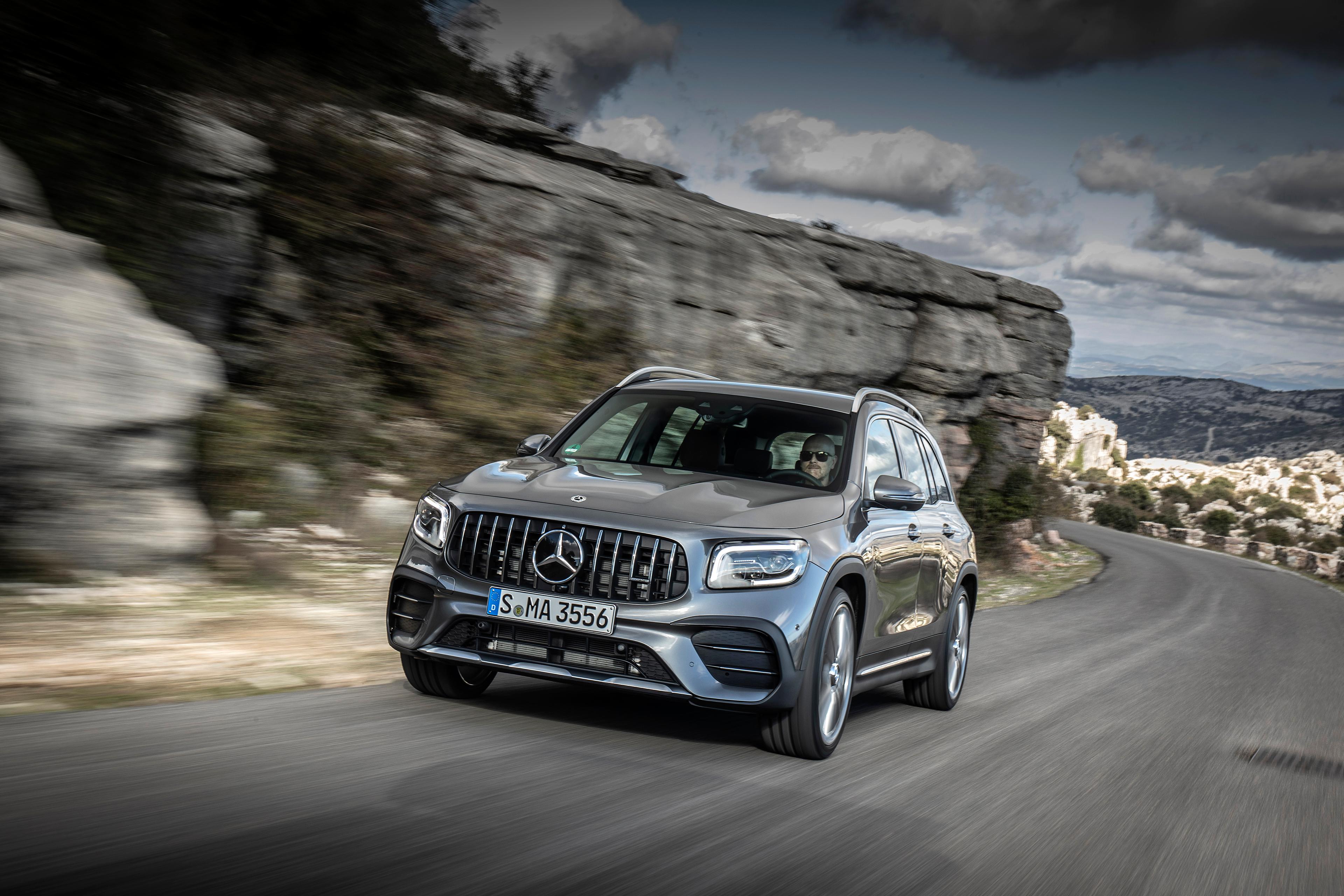 a grey Mercedes GLB driving on a mountain road