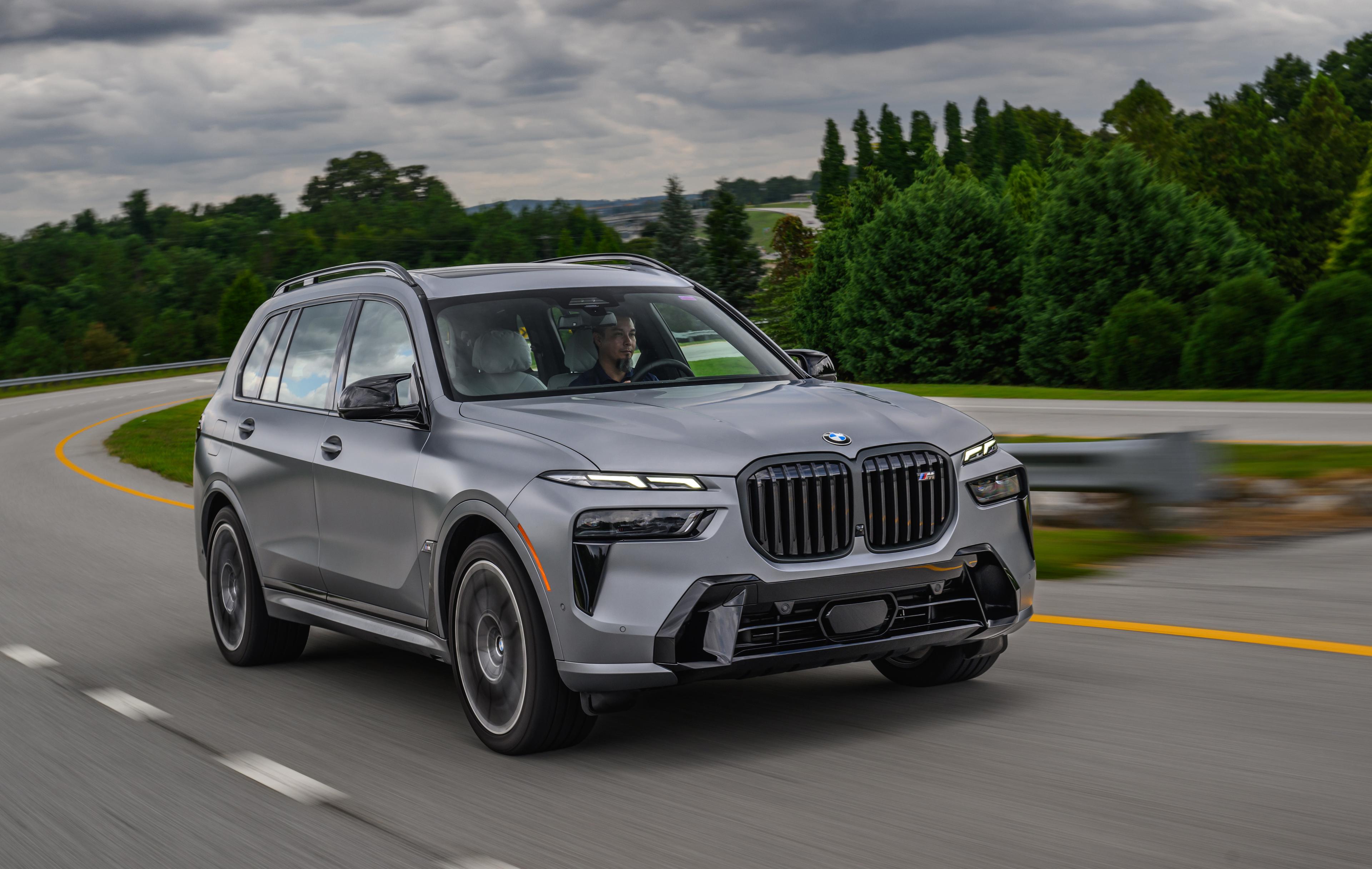 Grey BMW X7 driving on road