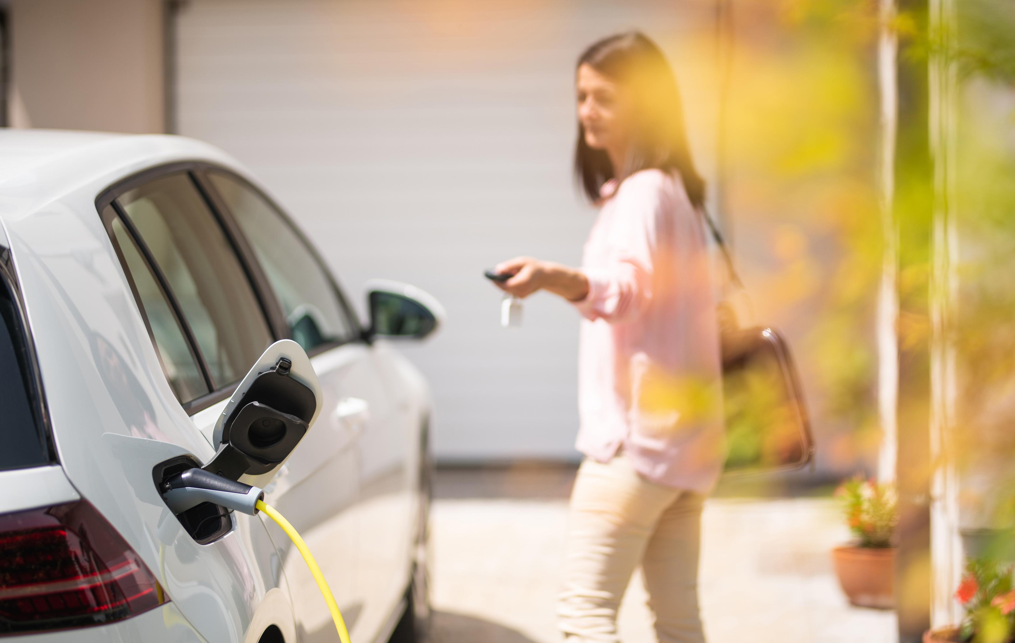 Ev charging woman cropped.jpg