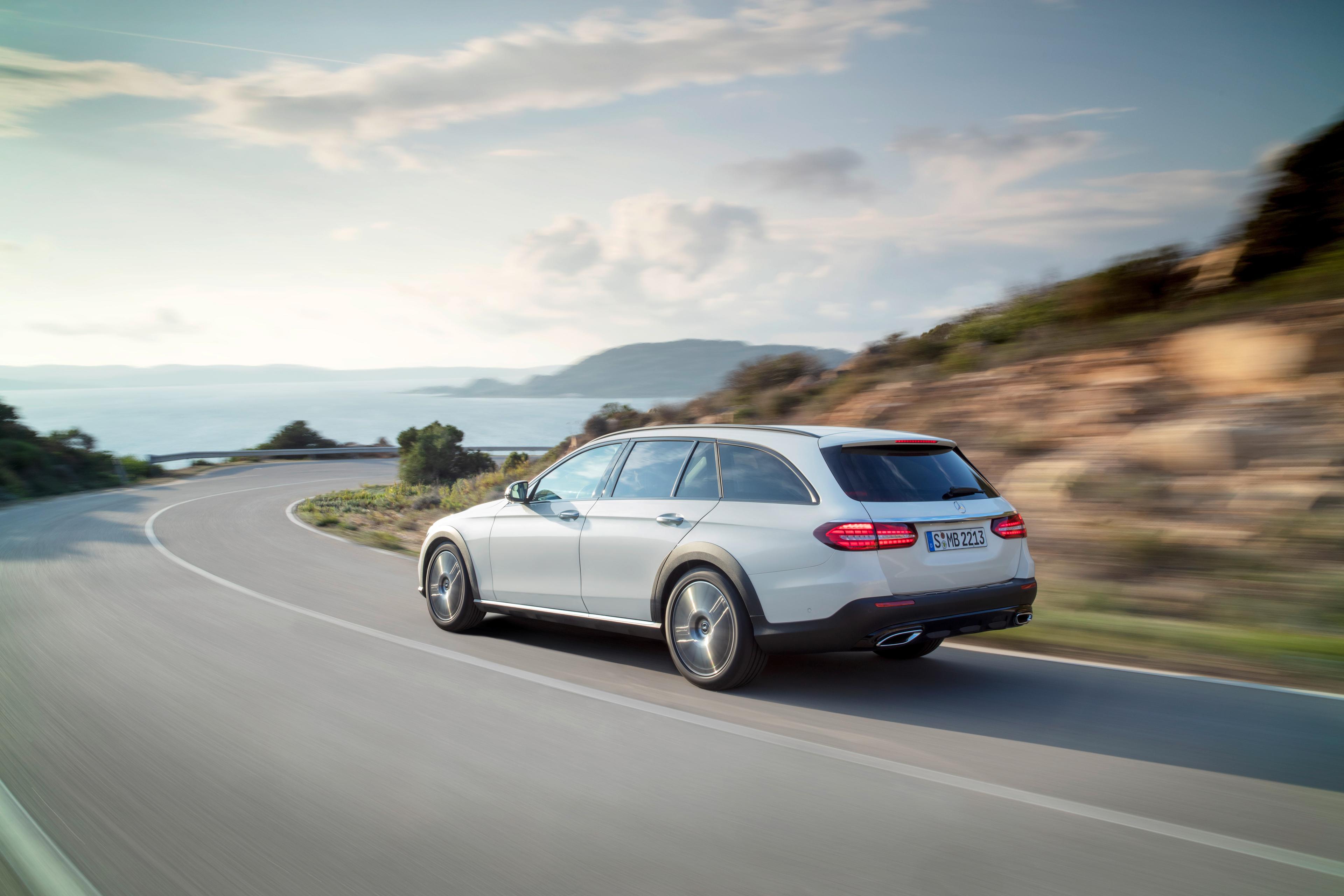 A white Mercedes E Class estate model