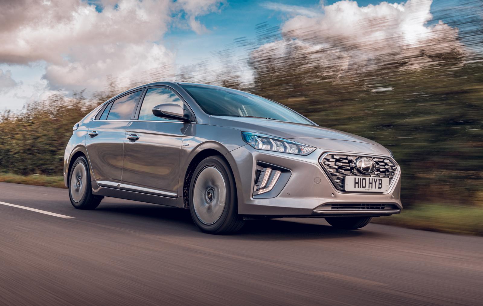 grey hyundai ioniq driving in the countryside