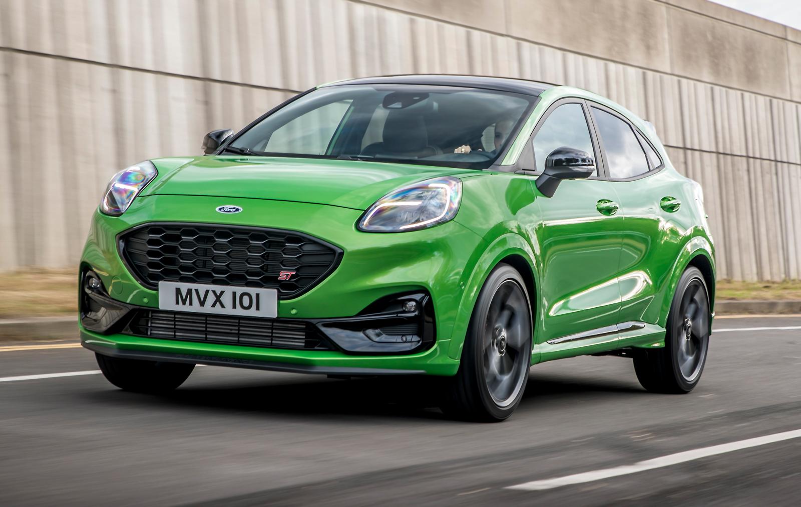 a bright green ford puma st driving on a road in the UK