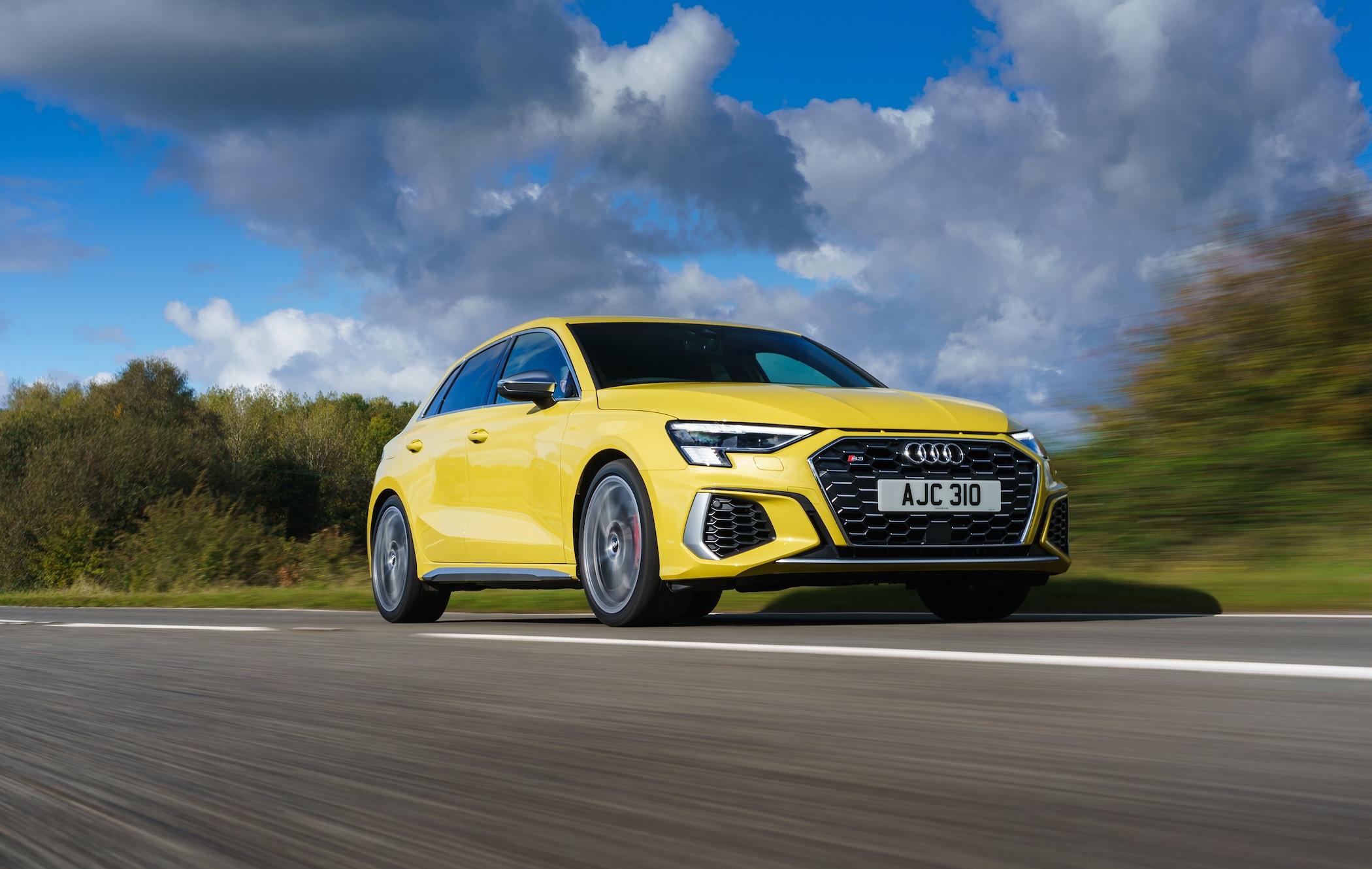 Yellow Audi S3 Sportback driving on road