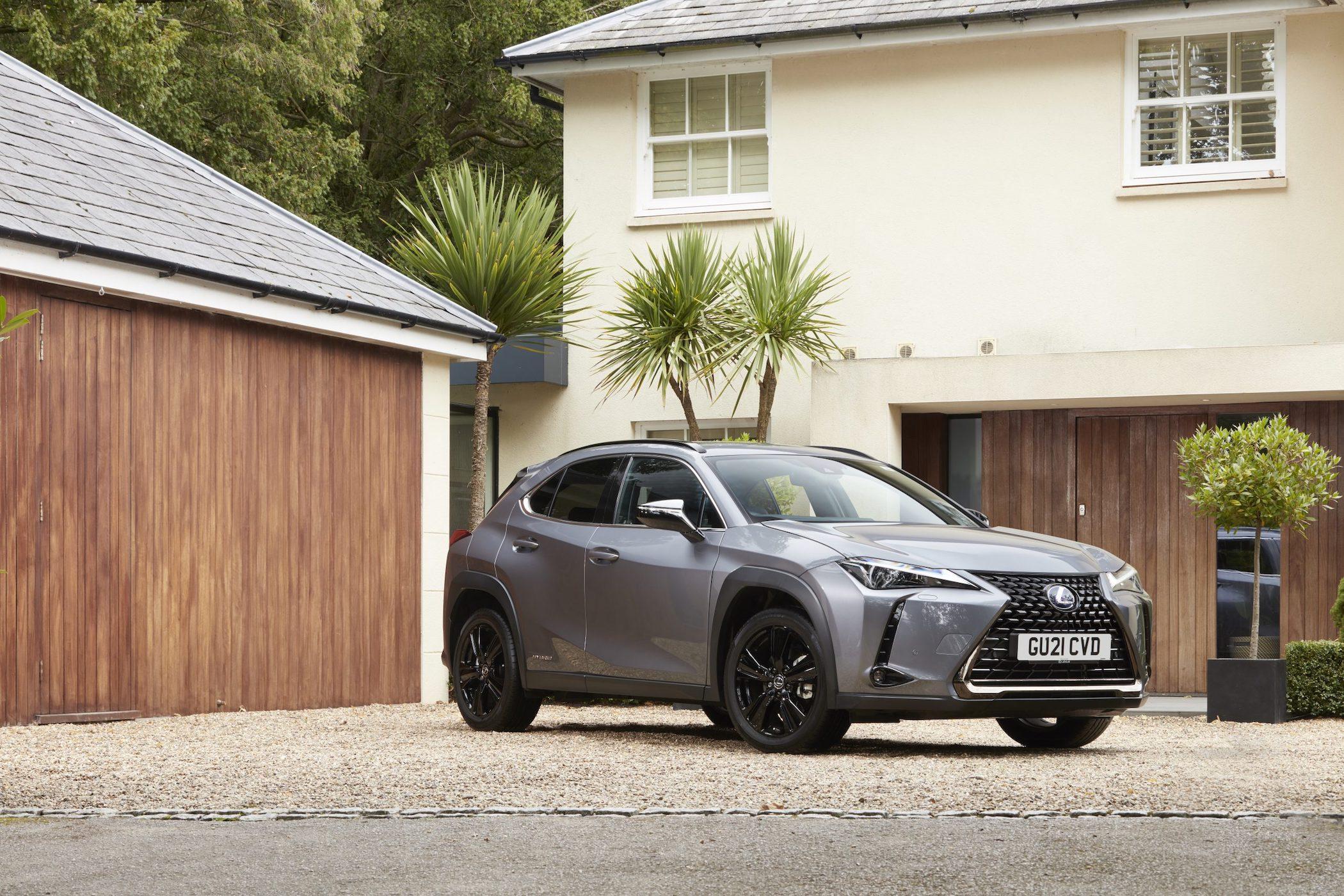 grey lexus ux suv parked outside a house 