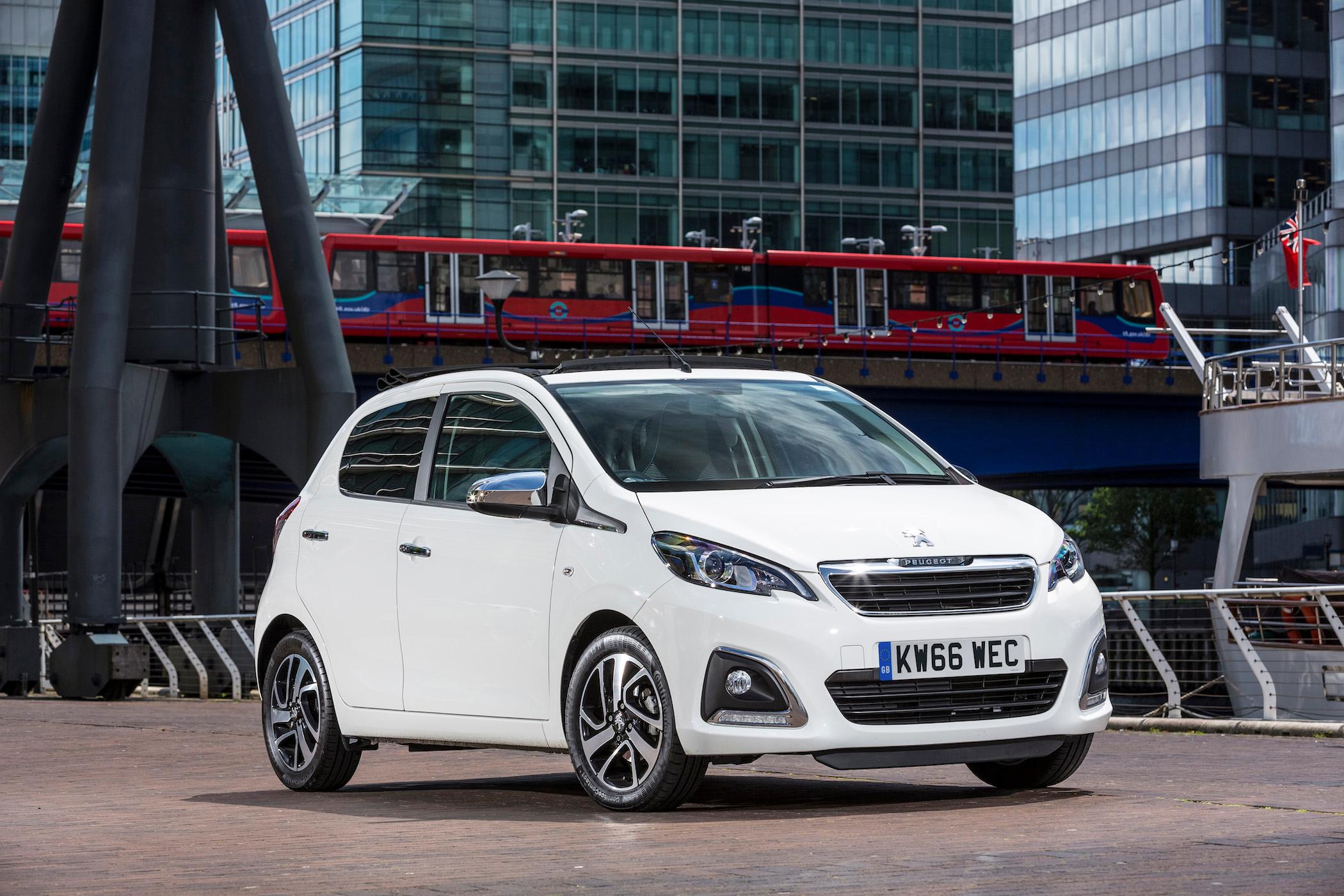 a white peugeot 108 parked in london