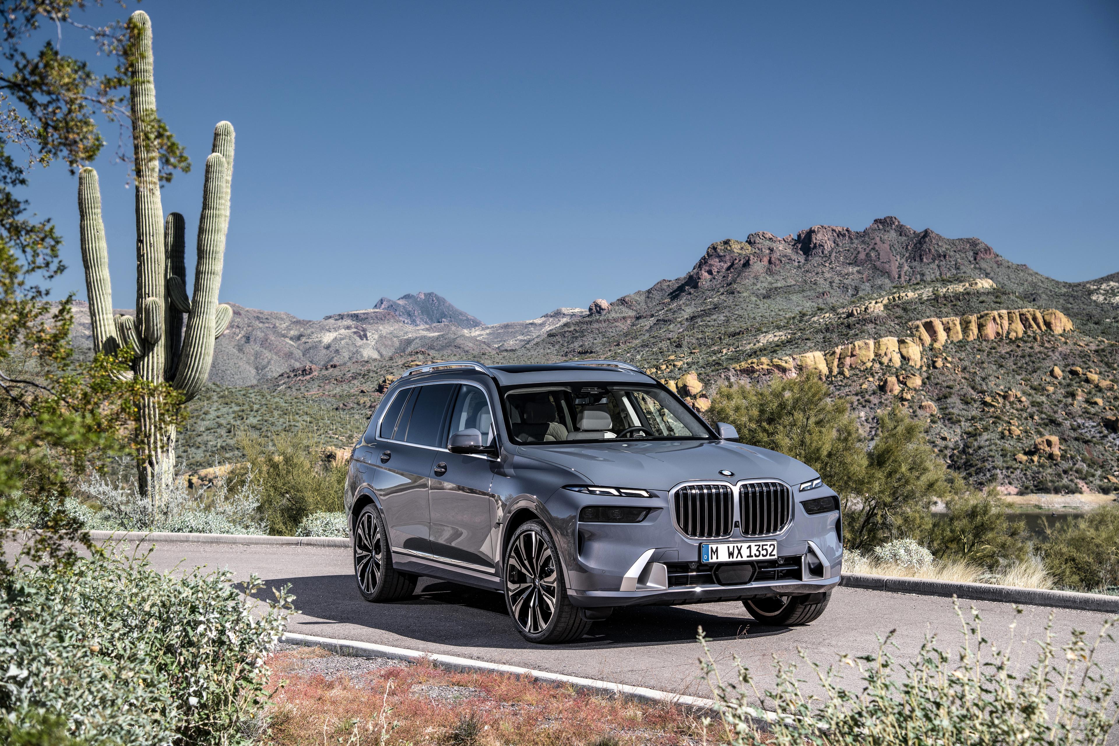 A grey BMW X7 driving in the desert 