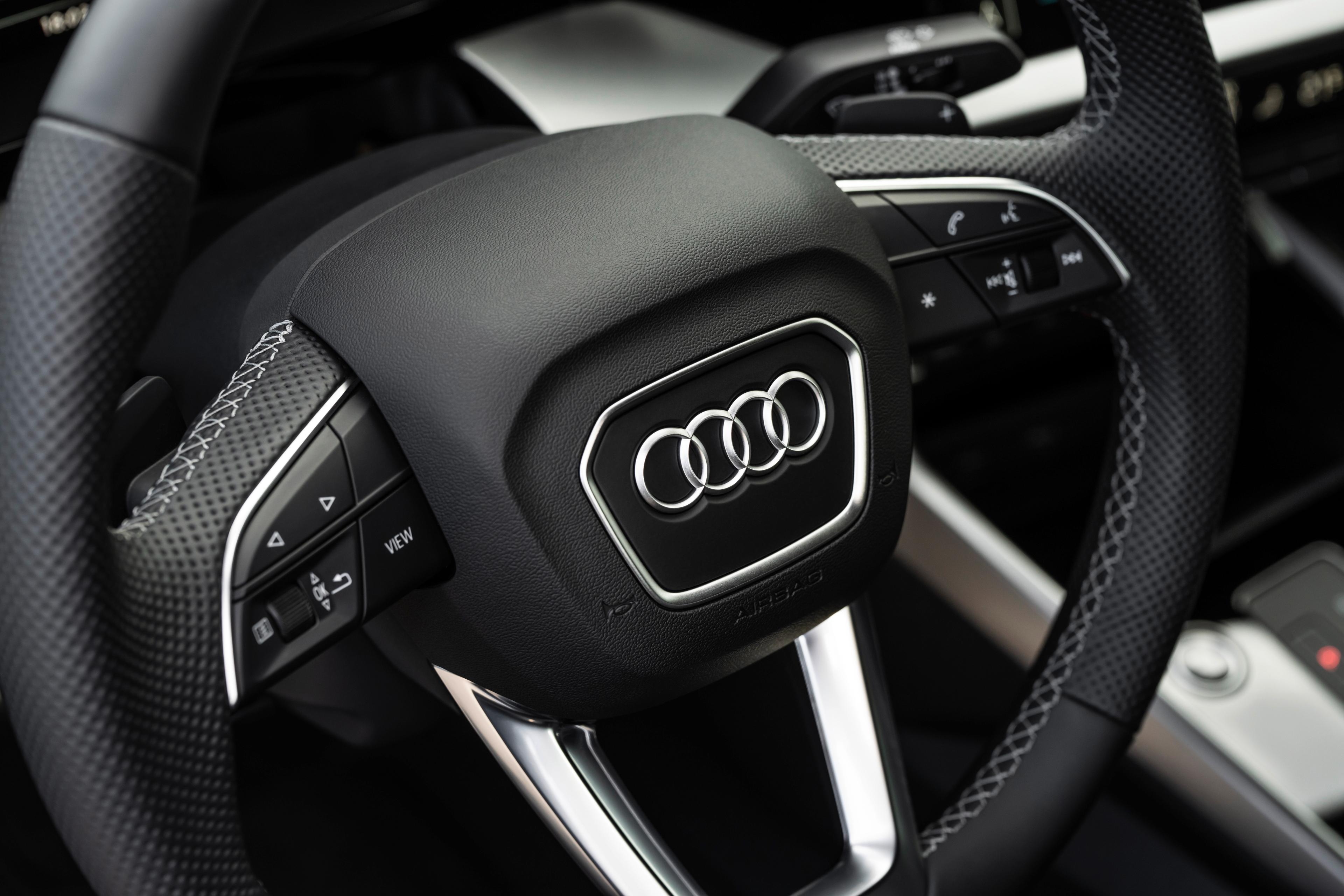A close up shot of an Audi steering wheel
